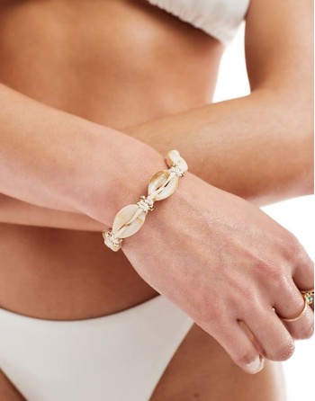 bracelet with faux shell and gold bead design