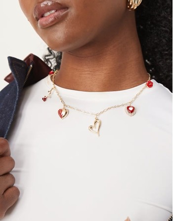 multi hearts charm necklace in gold
