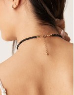 necklace with cord and starfish charm in gold tone