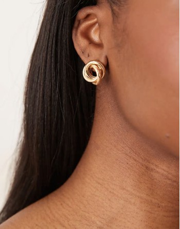 earrings in knot design in gold tone