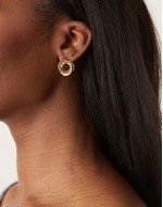 earrings in knot design in gold tone