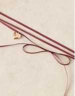 choker necklace with ribbon and puff heart pendant in burgundy tone