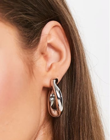hoop earring with twist link design in silver tone