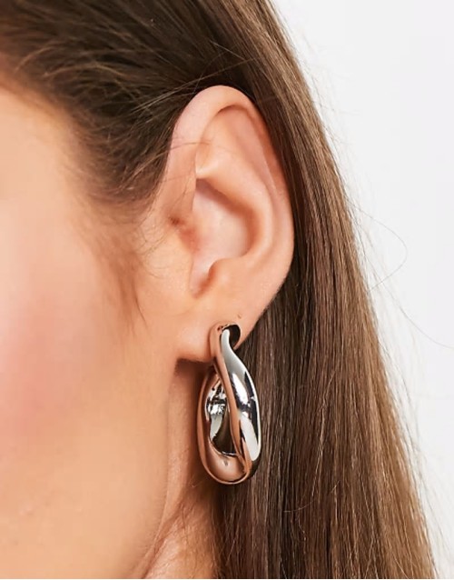 hoop earring with twist link design in silver tone