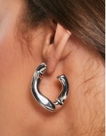 hoop earring with twist link design in silver tone