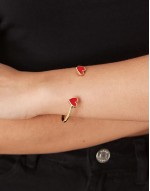 cuff bracelet with enamel heart detail in gold tone