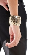 cuff bracelet with textured weave design in gold tone